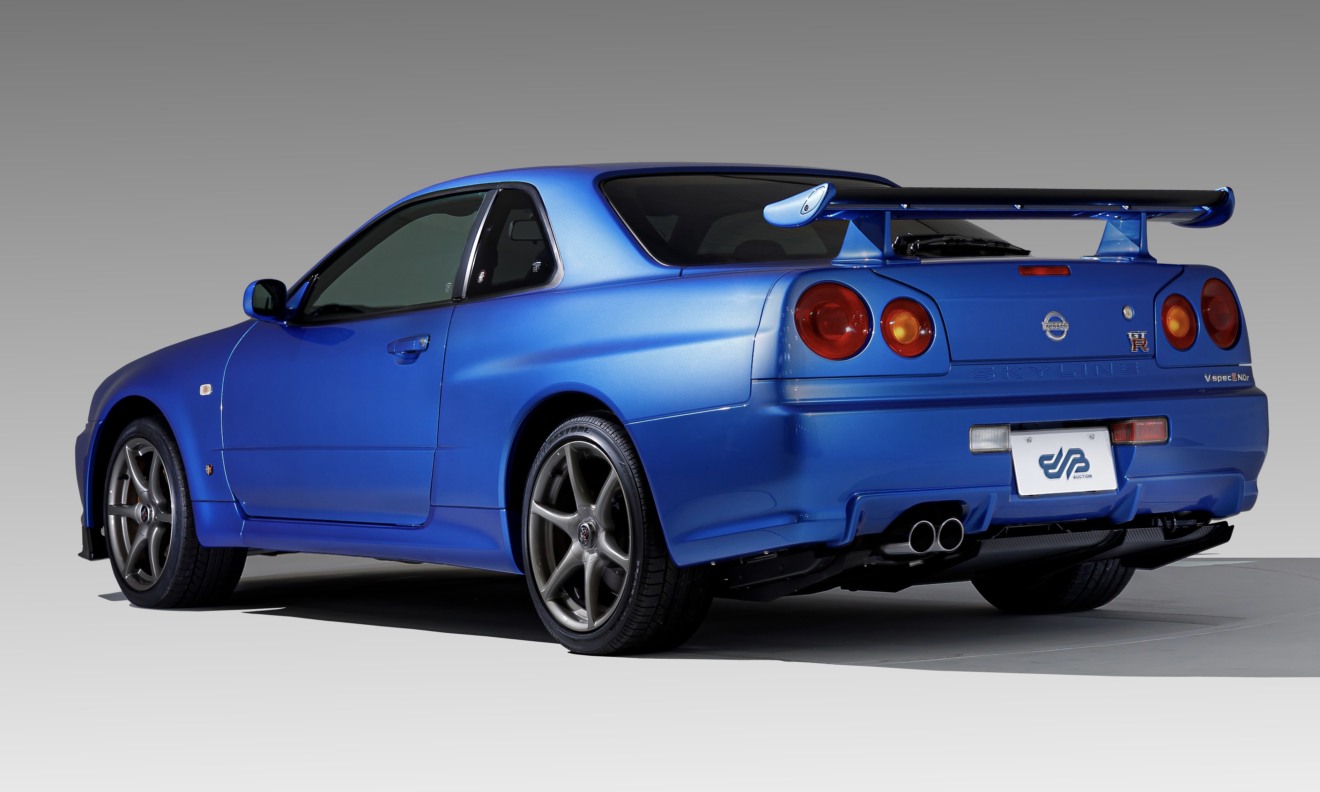 Nissan Skyline GT-R R34 azul em 3x4 traseira