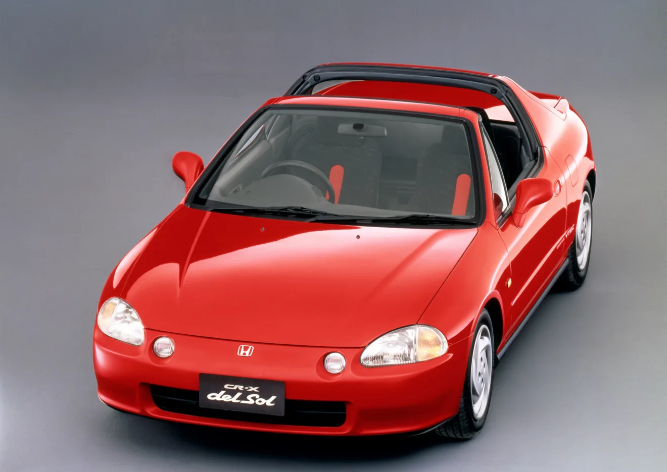 Honda Civic CR-X del Sol vermelho parado de frente