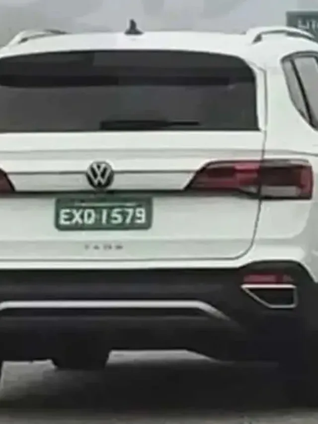 Novo Volkswagen Taos branco de traseira andando na estrada