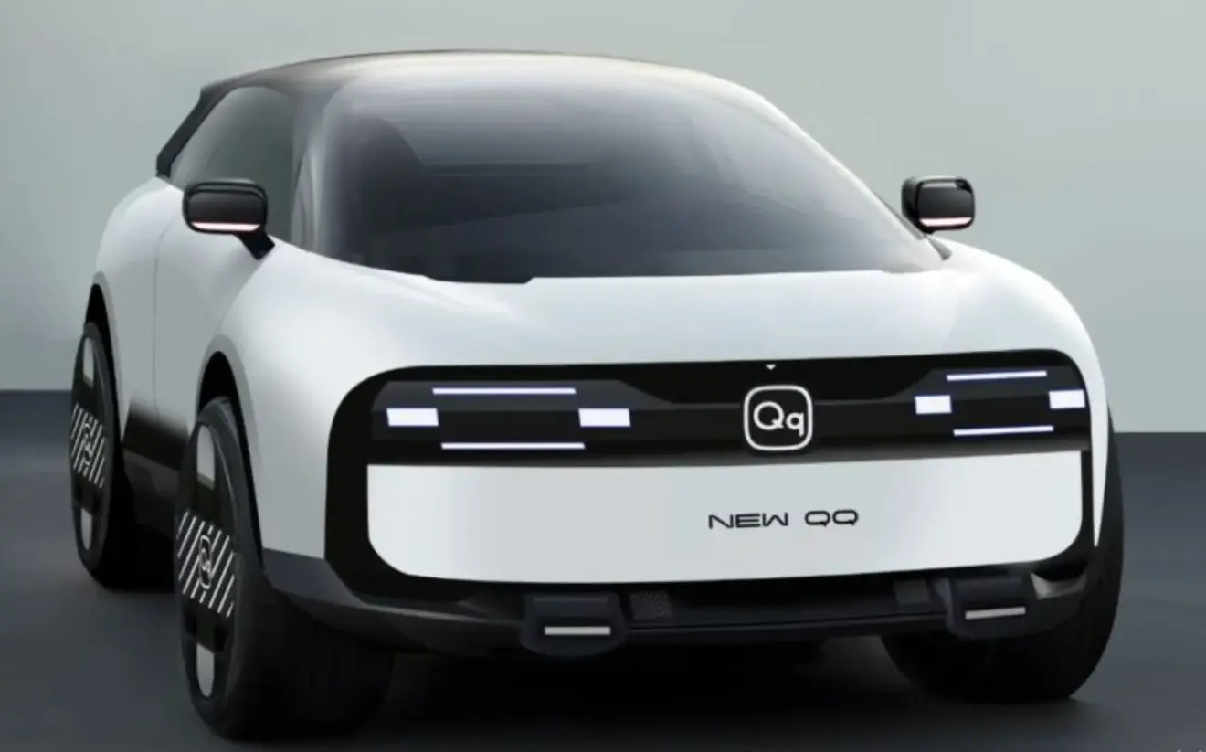 Chery QQ concept branco com detalhes pretos, faróis acesos e visto de frente