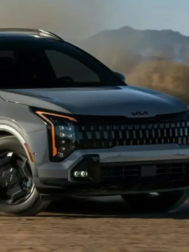 Novo Kia Sportage cinza andando na terra