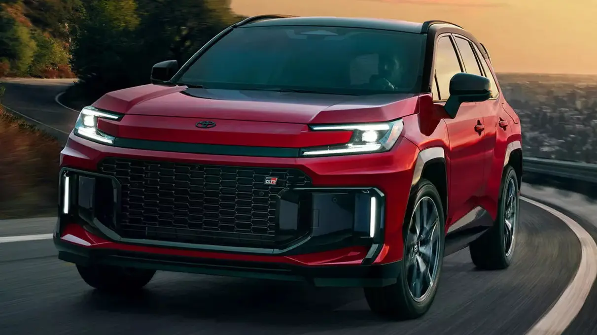 Toyota RAV4 GR-Sport vermelho com detalhes pretos, visto de tfrente e com faróis acesos