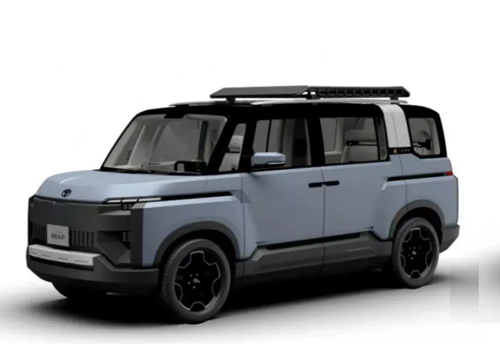 Toyota X Van Gear azul parada de frente com fundo neutro