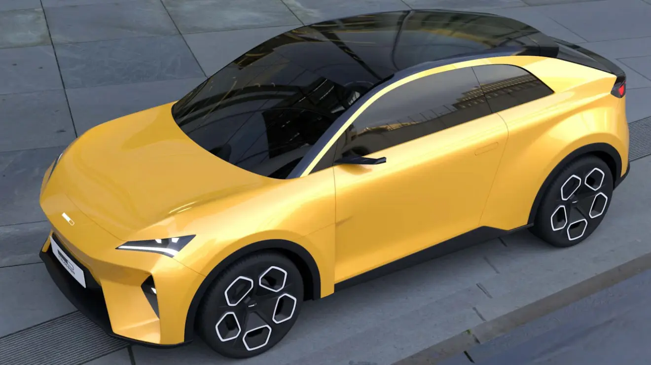 Volkswagen EVX cupê amarelo visto de cima e com faróis acesos