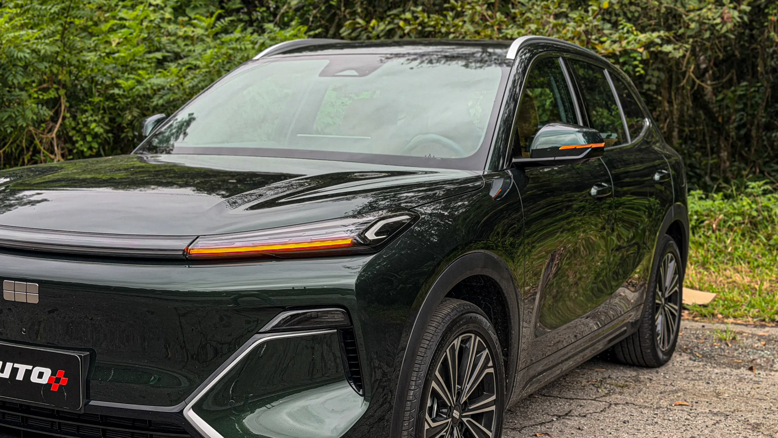Geely EX5 EM-i verde estático para avaliação e teste