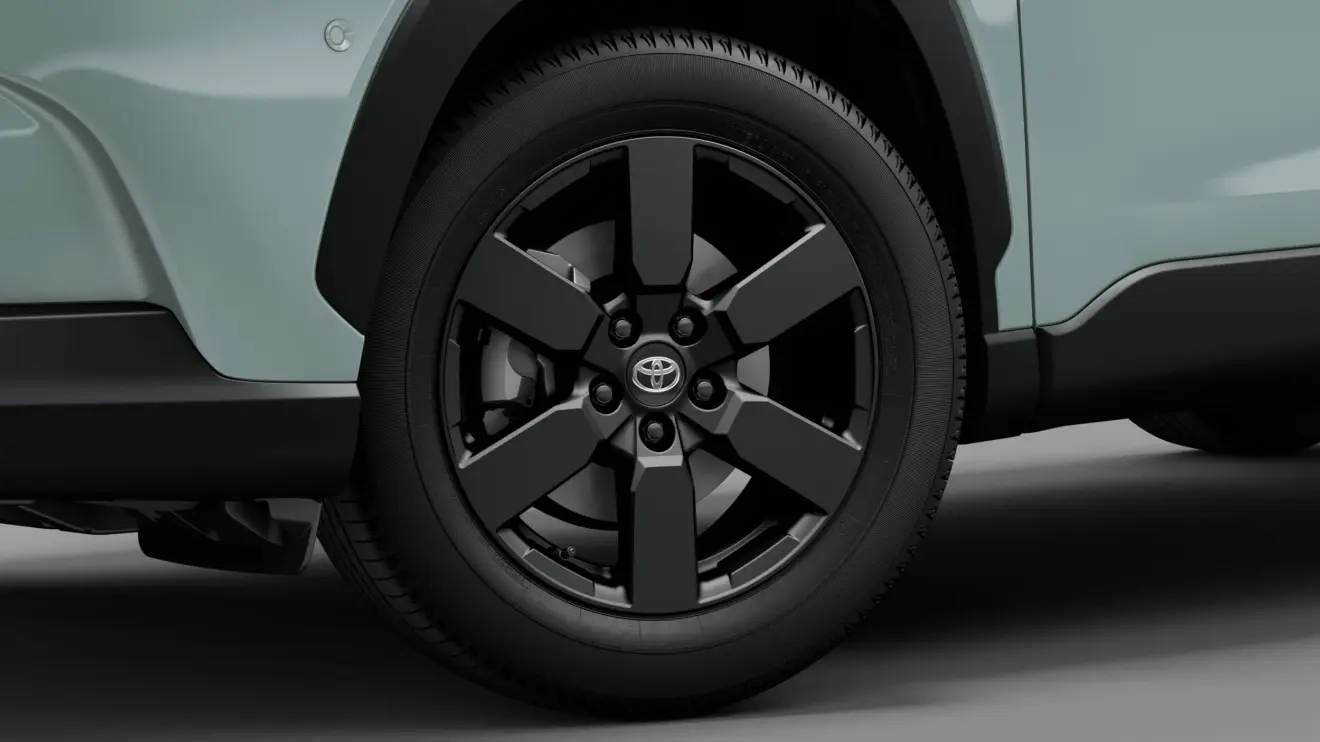 Toyota Corolla Cross Z Adventure estático com fundo preto na cor verde