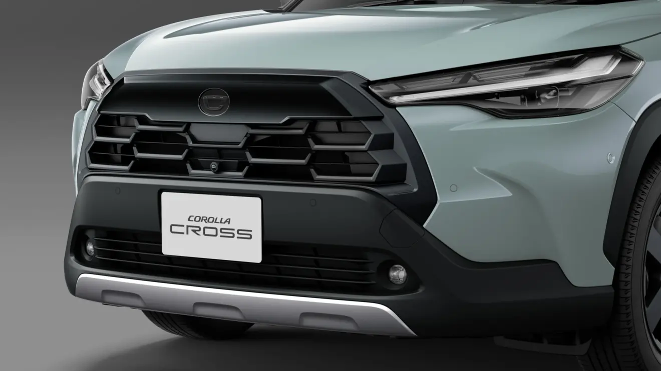 Toyota Corolla Cross Z Adventure estático com fundo preto na cor verde