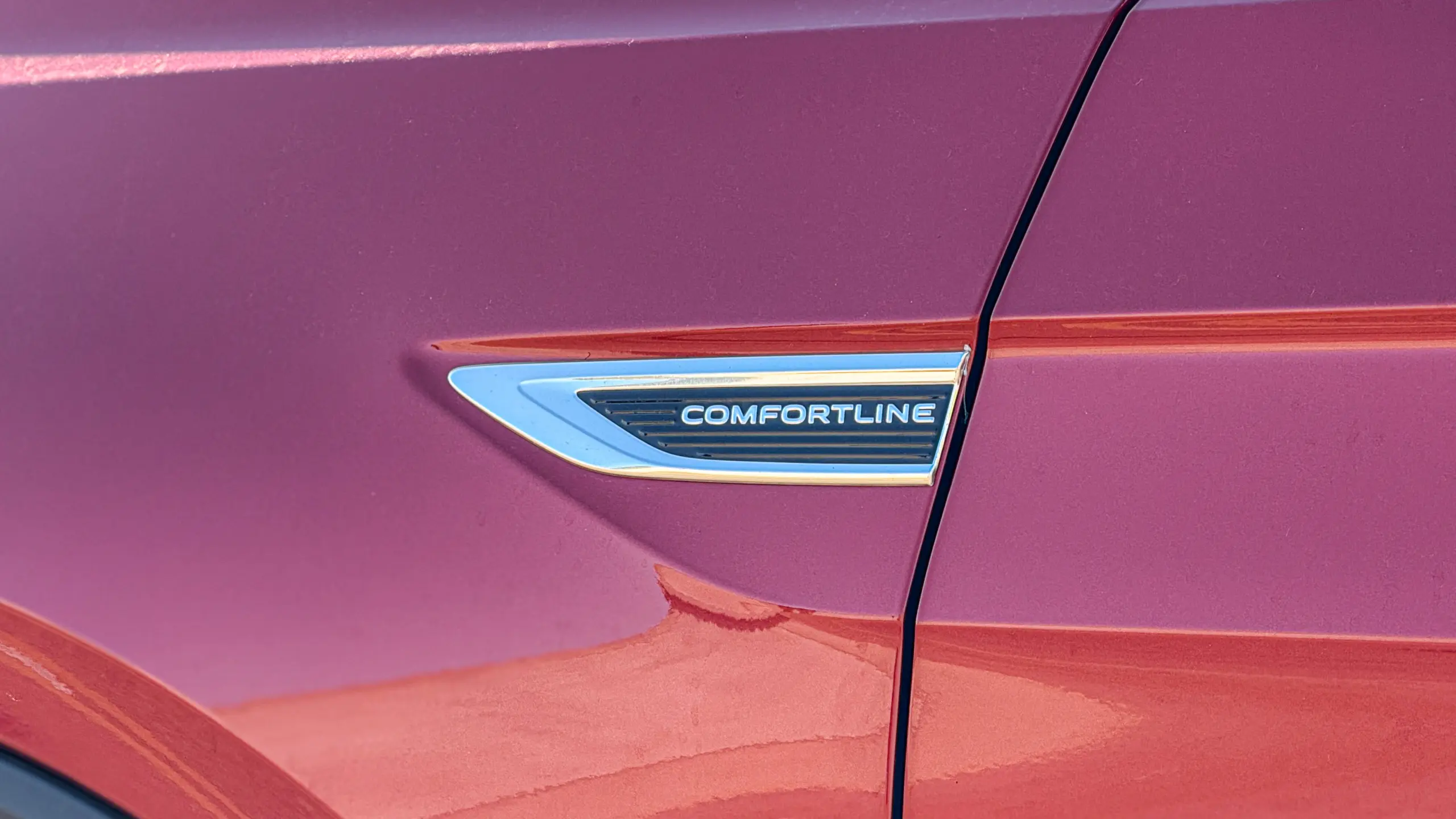 Volkswagen T-Cross Comfortiline Vermelho Sunset estático